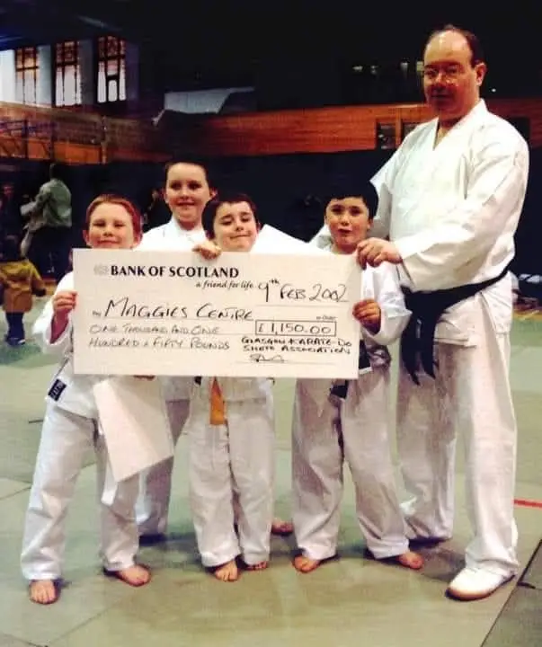 Juniors presenting a charity cheque for Maggie's Centre in 2002