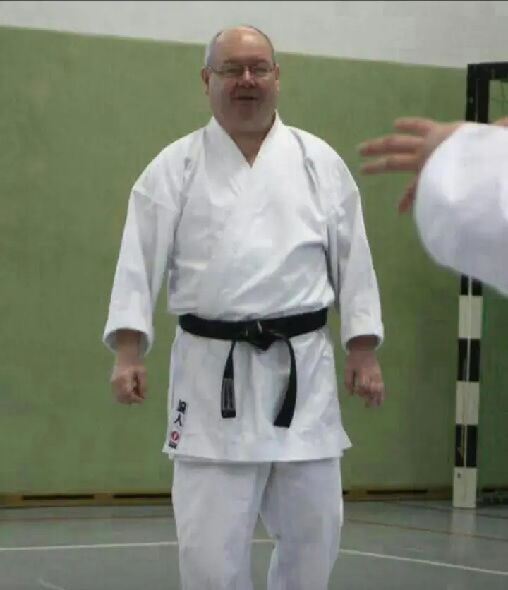 An instructor smiling in the hall in Plauen