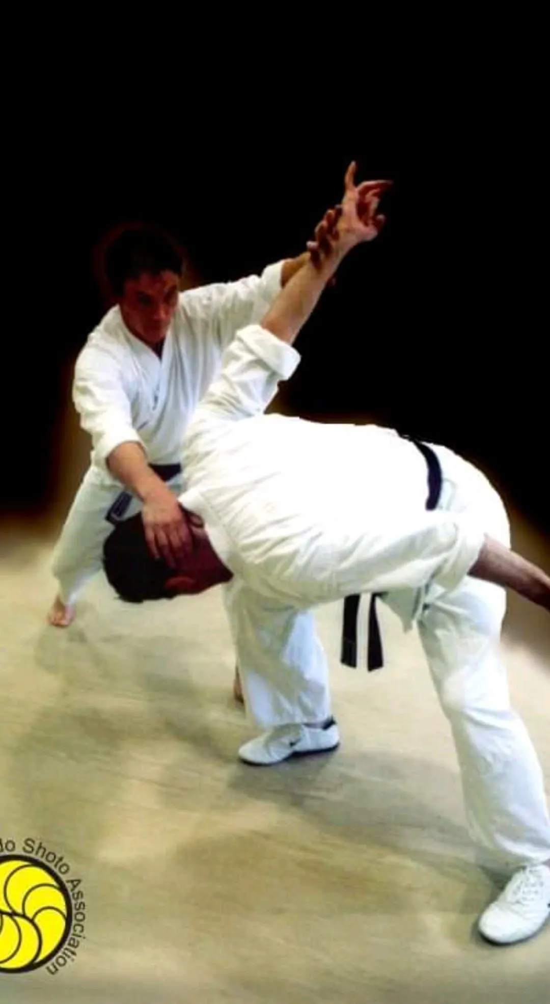 A throw caught mid-air against a dark background